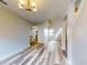Elegant dining room with hardwood floors and chandelier at 107 Littleton Cir, Deland, FL 32724