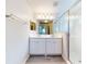 Double vanity bathroom with a walk-in shower at 107 Littleton Cir, Deland, FL 32724