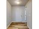 Bright entryway with light wood-look flooring and white interior doors at 107 Littleton Cir, Deland, FL 32724