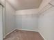 Walk-in closet with wire shelving and carpeted floor at 107 Littleton Cir, Deland, FL 32724