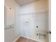 Bright laundry room with shelving and hookups at 107 Littleton Cir, Deland, FL 32724