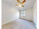 Spacious bedroom with carpeted floor and a ceiling fan at 107 Littleton Cir, Deland, FL 32724