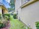 Narrow side yard with grass and landscaping at 107 Littleton Cir, Deland, FL 32724