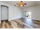 Bright living room with vinyl plank flooring and sliding glass doors to patio at 107 Littleton Cir, Deland, FL 32724
