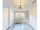 Spacious dining room with hardwood floors and large window at 107 Littleton Cir, Deland, FL 32724