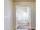 Hallway with archway leading to another room, light wood-look flooring at 107 Littleton Cir, Deland, FL 32724