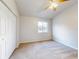 Bedroom with window, ceiling fan and closet at 107 Littleton Cir, Deland, FL 32724