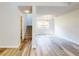 Spacious dining area with hardwood floors and chandelier at 107 Littleton Cir, Deland, FL 32724