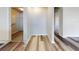 Hallway with access to closet and other rooms, light wood-look flooring at 107 Littleton Cir, Deland, FL 32724