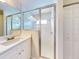 Bathroom featuring a walk-in shower and white vanity at 107 Littleton Cir, Deland, FL 32724