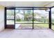 Spacious screened porch overlooking backyard at 107 Littleton Cir, Deland, FL 32724