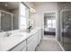 Bathroom with double vanity and walk-in shower at 814 Canyon Creek Dr, New Smyrna Beach, FL 32168
