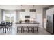 Modern kitchen featuring granite countertops, white cabinets, and a large island at 814 Canyon Creek Dr, New Smyrna Beach, FL 32168