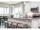 Spacious kitchen with granite countertops, white cabinets, and stainless steel appliances at 814 Canyon Creek Dr, New Smyrna Beach, FL 32168