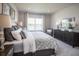 Spacious bedroom with large window and dresser at 814 Canyon Creek Dr, New Smyrna Beach, FL 32168