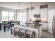 Modern kitchen with island, stainless steel appliances and white cabinets at 1897 Basenji Dr, Lake Alfred, FL 33850