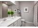 Clean bathroom with double vanity and shower at 1897 Basenji Dr, Lake Alfred, FL 33850