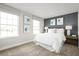 Bright bedroom with a queen bed and calming decor at 3057 Ruby Falls Dr, Deland, FL 32724