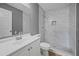 Modern bathroom with marble shower and white vanity at 77 Redwood Rd, Ocala, FL 34472