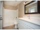 Clean bathroom with a shower/tub combo and white vanity at 90 Dogwood Drive Cir, Ocala, FL 34472