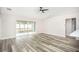 Living room with vinyl flooring, sliding glass doors, and access to patio at 90 Dogwood Drive Cir, Ocala, FL 34472