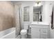 Bathroom with tub, shower, white vanity, and neutral tile at 1163 Turtle Island Rd, Lady Lake, FL 32159