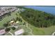 Aerial view of a community park with playground and lake access at 6923 Five Oaks Dr, St Cloud, FL 34773