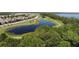 Aerial view of community with lakes, walking paths, and lush green spaces at 6923 Five Oaks Dr, St Cloud, FL 34773