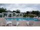 Inviting community pool with lounge chairs under a pergola at 6923 Five Oaks Dr, St Cloud, FL 34773