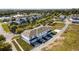 Aerial view of townhomes near a lake at 6923 Five Oaks Dr, St Cloud, FL 34773