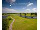 Golf course at Harmony with water features and a scenic walking path at 6923 Five Oaks Dr, St Cloud, FL 34773