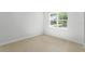 Simple bedroom with large window and tile floor at 6923 Five Oaks Dr, St Cloud, FL 34773