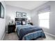 Cozy bedroom with a full-size bed and nautical-themed decor at 1337 Laramie Way, Haines City, FL 33844