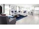 Open concept kitchen and living area with modern appliances and ample seating at 1337 Laramie Way, Haines City, FL 33844