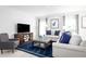 Spacious living room with comfortable sofas and a large TV at 1337 Laramie Way, Haines City, FL 33844