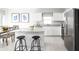 Modern kitchen with a large island, granite countertops, and stainless steel appliances at 1337 Laramie Way, Haines City, FL 33844