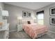 Charming bedroom with a ruffles bedspread and neutral decor at 1649 Laia Rd, Haines City, FL 33844