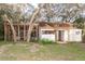 Small guest house with screened porch and mature trees at 6000 Marthas Ln, Saint Cloud, FL 34771