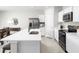 Bright kitchen boasts stainless steel appliances and an expansive island at 1602 Minnesota Rd, Sumterville, FL 33585