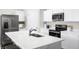 Modern kitchen with stainless steel appliances and white cabinetry at 1602 Minnesota Rd, Sumterville, FL 33585