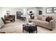 Open living and kitchen area with comfortable furniture at 1602 Minnesota Rd, Sumterville, FL 33585