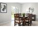 Dining area with large table and access to the backyard at 1602 Minnesota Rd, Sumterville, FL 33585
