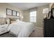 Bedroom with a queen-size bed and neutral decor at 2310 Incandescent Way, South Daytona, FL 32119