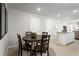 Cozy dining area with round table and four chairs at 2310 Incandescent Way, South Daytona, FL 32119