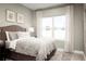 Bright bedroom with a queen-size bed and backyard view at 5745 Anders Way, St Cloud, FL 34771