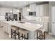 Spacious kitchen island with white cabinets and quartz countertops at 5745 Anders Way, St Cloud, FL 34771