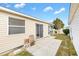 Home's backyard with a patio and some landscaping at 1052 Ridgeville Rd, The Villages, FL 32162