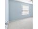 Light blue walls and neutral carpet in bedroom at 1052 Ridgeville Rd, The Villages, FL 32162
