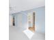 Bright bedroom with light blue walls and carpet at 1052 Ridgeville Rd, The Villages, FL 32162