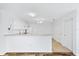 Bright eat-in kitchen with white cabinets and appliances at 1052 Ridgeville Rd, The Villages, FL 32162